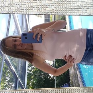 Light pink sleeveless mock neck top